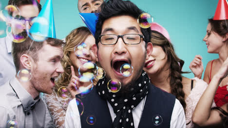 Multi-racial-group-of-happy-people-dancing-with-bubbles-slow-motion-party-photo-booth