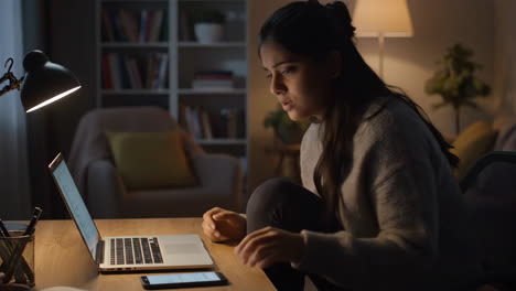 woman using laptop at desk