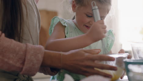 little-girl-helping-mother-bake-in-kitchen-mixing-ingredients-baking-cookies-preparing-recipe-at-home-with-mom-teaching-her-daughter-on-weekend