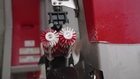 automatic milking machine spins the wheel brush as water pours out