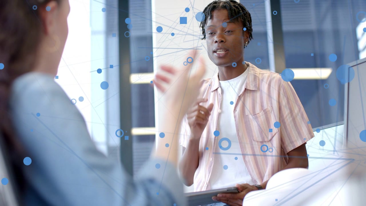 Male colleague checking tablet after woman gesturing, replying in business, blue nodes over hands