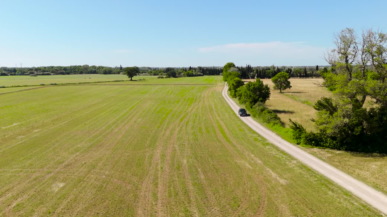 rural landscape with fields and trees under bright summer sky aerial