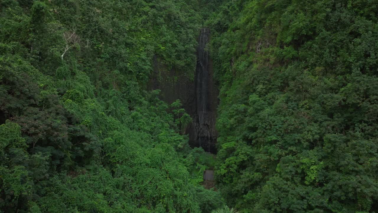 Vairao Taiarapu Vaimahutu Faarumai Matiti Waterfall Falls Tahiti Island aerial drone French Polynesia road to Teahupoo dense lush green jungle forest Les Trios Cascades pool nature backwards motion
