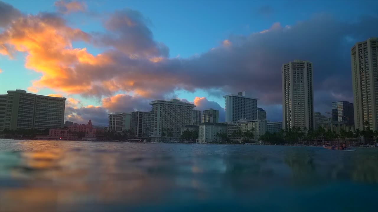 Waikiki beach during sunset filmed from the ocean, Honolulu Hawaii