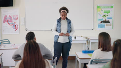 a teacher giving a lesson to students in a classroom