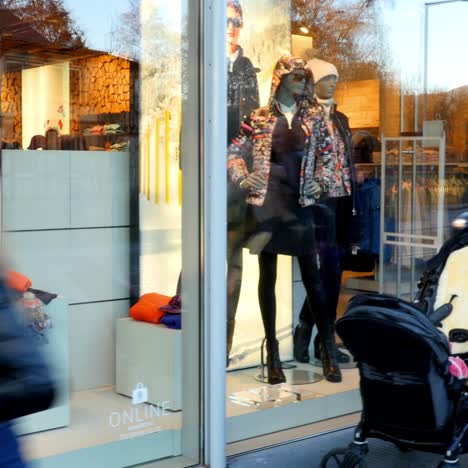 busy street scene with shop window display