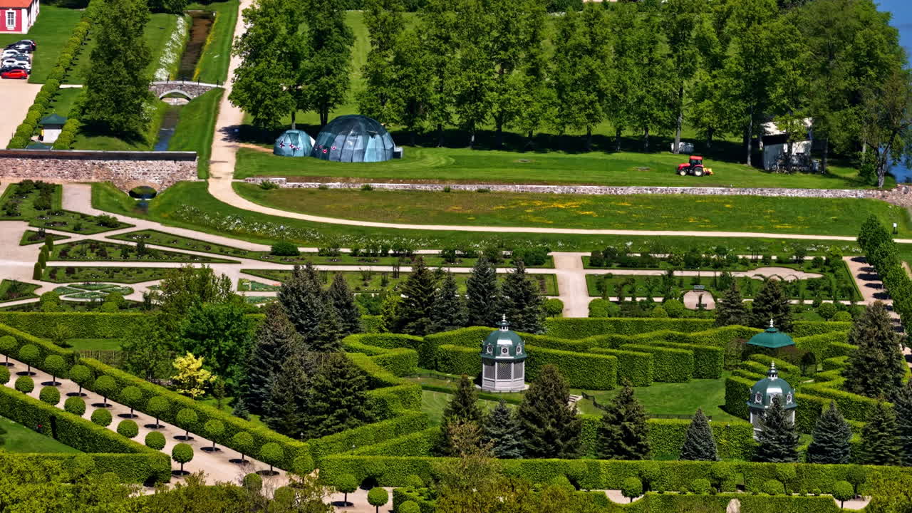 Beautiful and symetrical park of huge mansion, aerial view