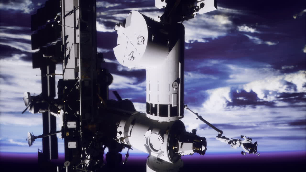 Iss visible in low earth orbit against a backdrop of clouds