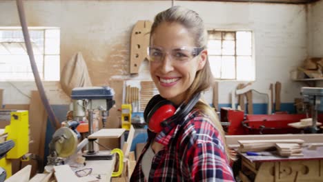 portrait of attractive carpenter smiling for camera