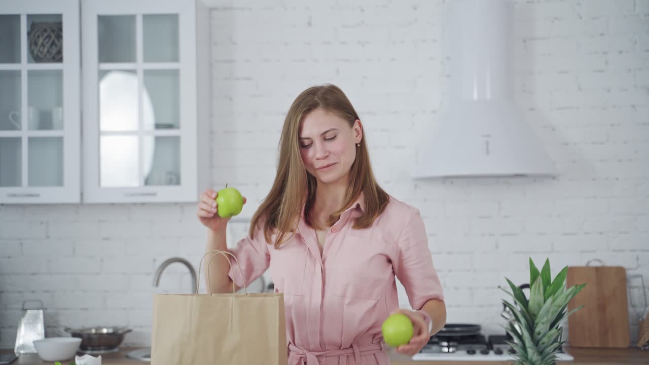 Woman with fresh apple eyes. Portrait of happy woman closing eyes by apples