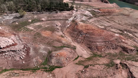 flyover aerial view sau reservoir colourful arid landscape with dry drought season low rivers surrounding hills