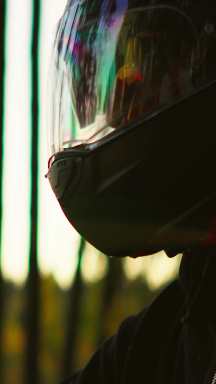 Motorcyclist Wearing Protective Gear and Helmet Sitting on Motorcycle