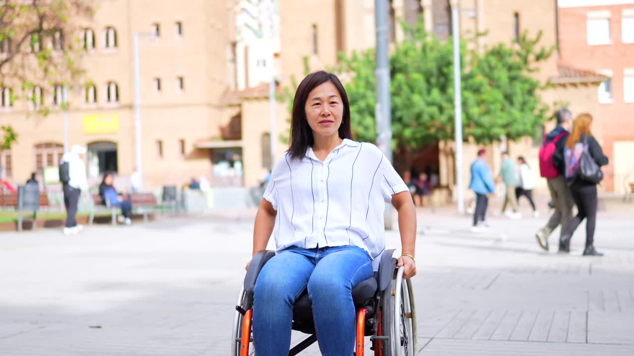 Woman in Wheelchair in Urban Setting