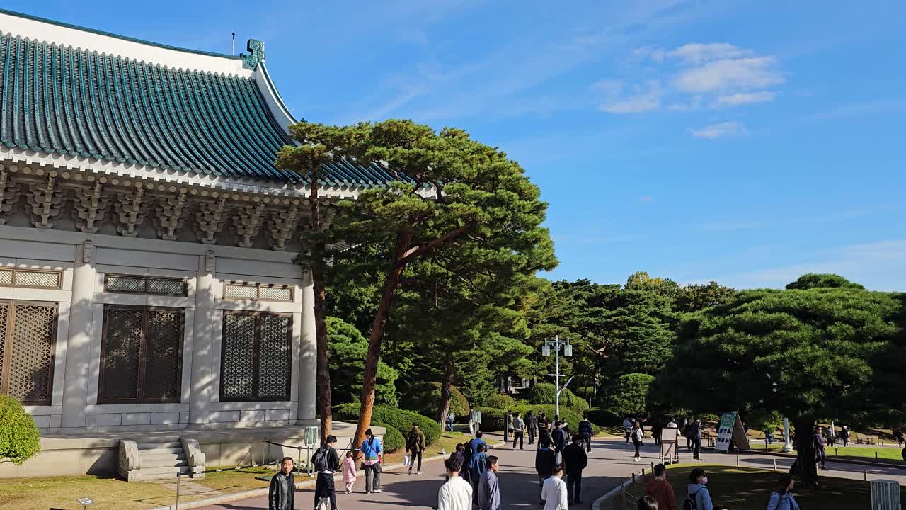 People Walking In Front Of Cheong Wa Dae, Blue House In Jongno-gu, Seoul, South Korea. - static shot