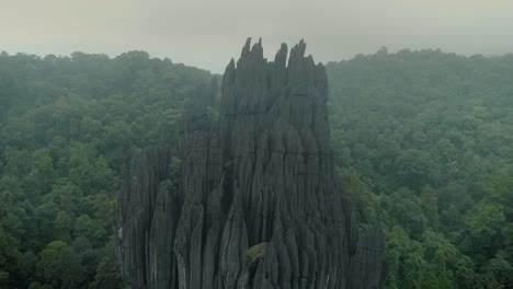 Huge-rock-monolith-on-the-forests-of-Yana-village,-in-Karnataka,-India,-under-fog