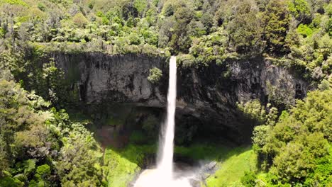 aerial pull back of a scenic watterfall