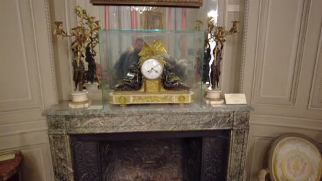 statues, a fireplace and a painting displayed in a museum in chapultepec, mexico