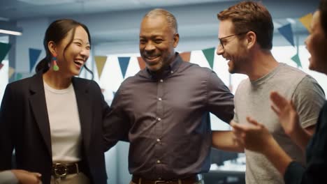 a group of diverse colleagues joyfully celebrating together in an office setting, demonstrating team spirit and camaraderie