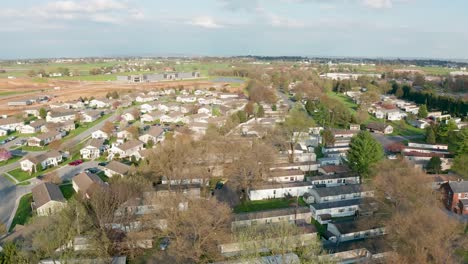 aerial turn reveals sprawling mobile home trailer court and park