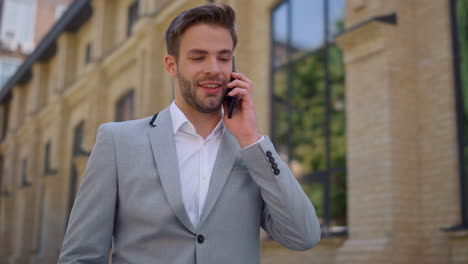 Businessman-using-mobile-phone-outdoors