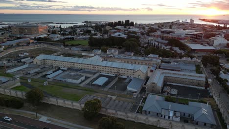 Drone-Flyover-Fremantle-Prison-Perth-Australia-Surrounded-by-Buildings-and-Cityscape