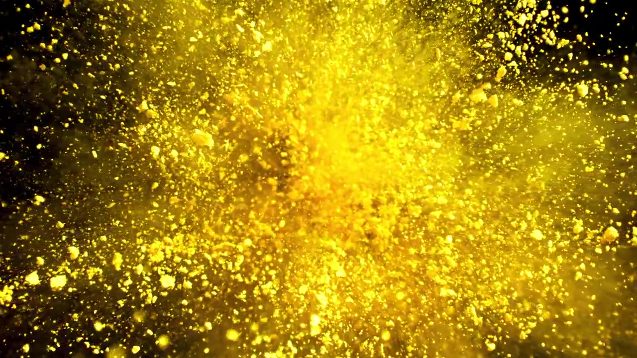 Esplosione al rallentatore di polvere gialla vibrante su sfondo nero