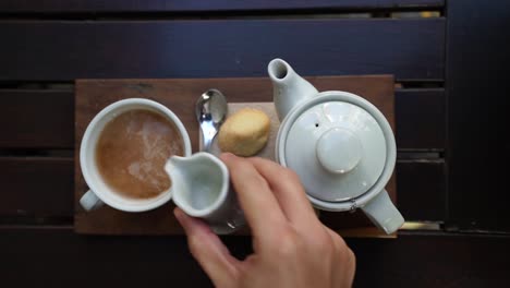 green tea being served with hot almond milk