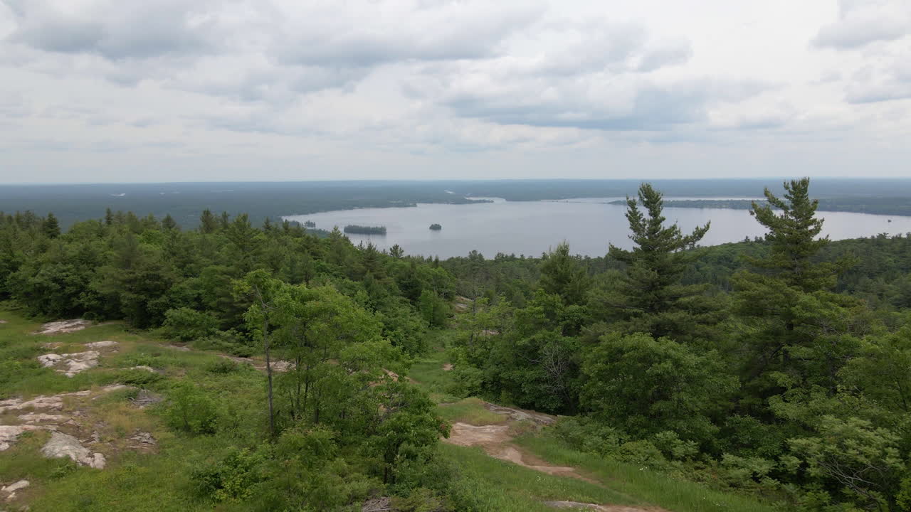 Aerial view of lake and forest along hillside. Calabogie ski hill, Ontario Canada