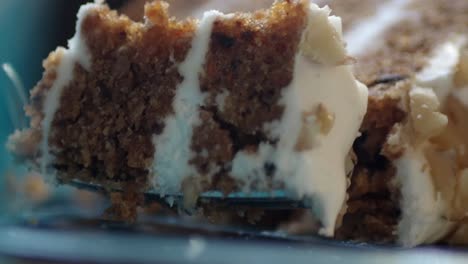 cutting a slice of delicious carrot cake