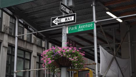 One-way-crosswalk-sign-at-Park-Avenue-South,-NYC-on-a-rainy-day