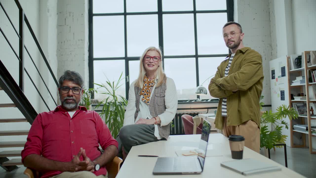 Group Portrait of Diverse Business Team at Meeting Table in Modern Office