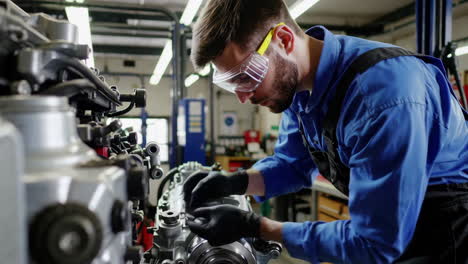 mechanic repairing a truck engine