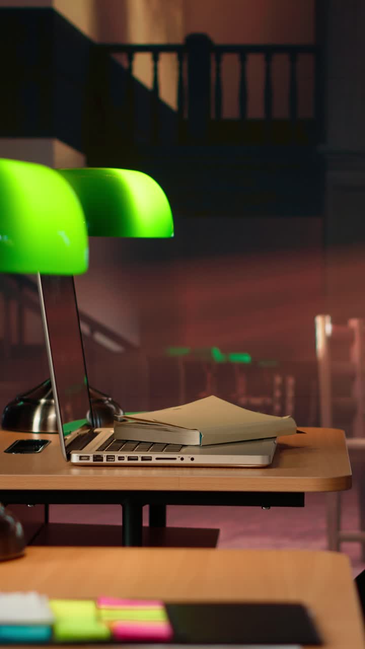 Laptop and Books on Desk in a Traditional Library Study Room