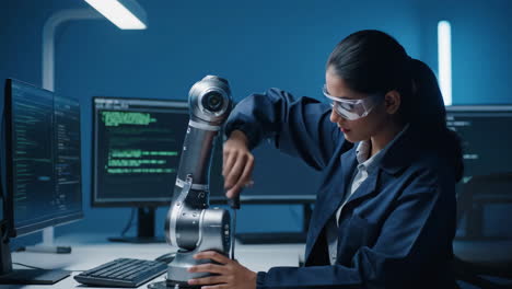woman engineer working with robotic arm and code