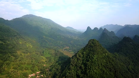 aerial view of lush green forested hills in vietnam