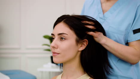 Woman-receiving-a-head-massage