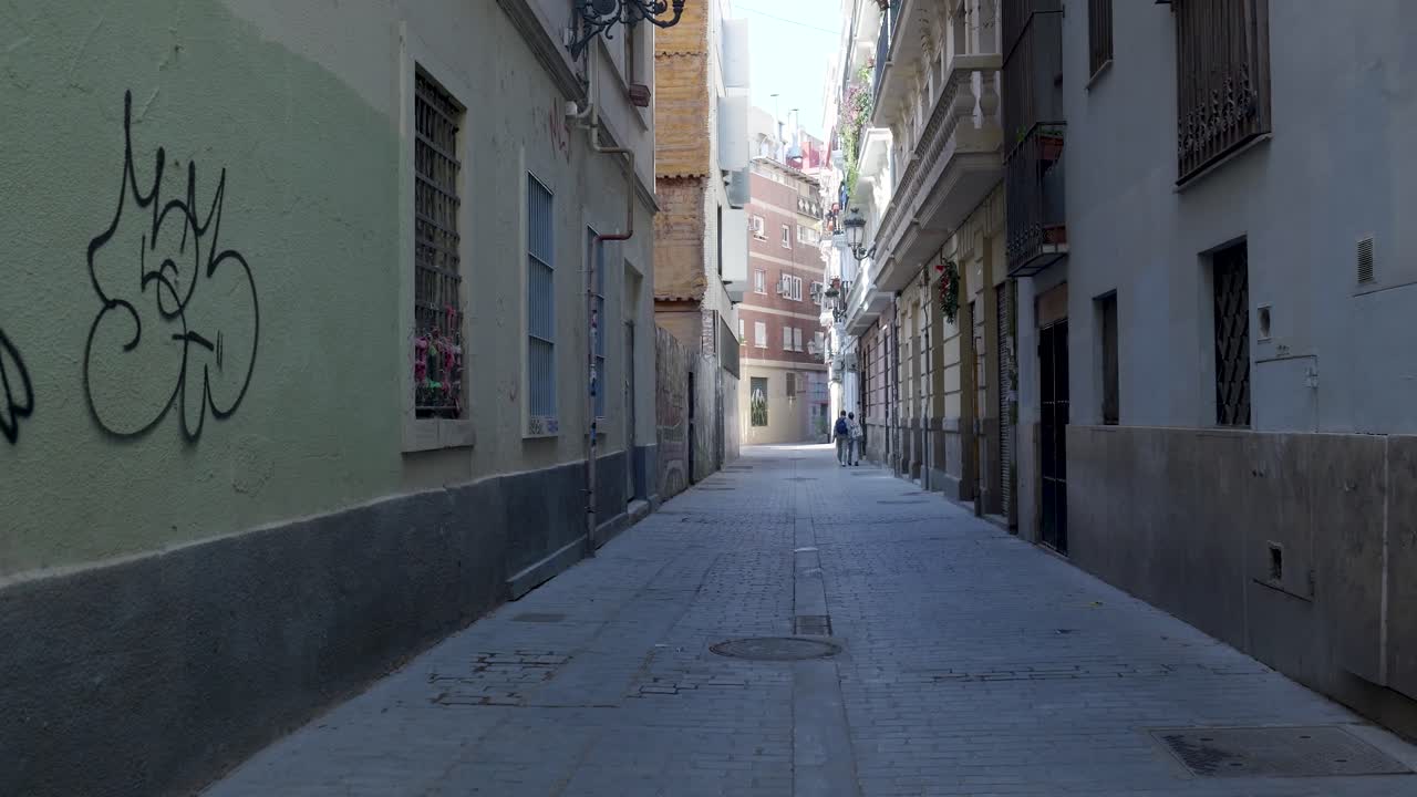 Narrow City Alley with People