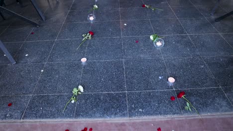 path-decorated-with-candles,-tree-leaves,-and-flowers-high-angle-shot