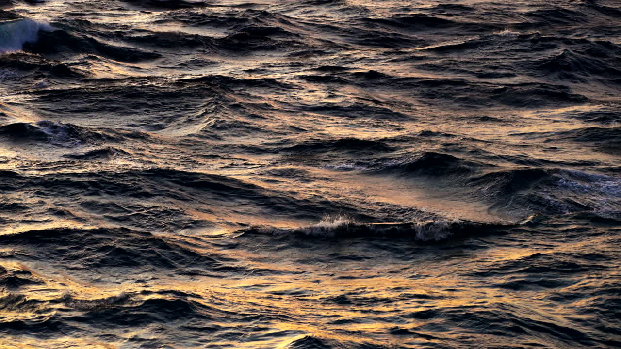 Sunlit Waves Of Ocean During Sunset