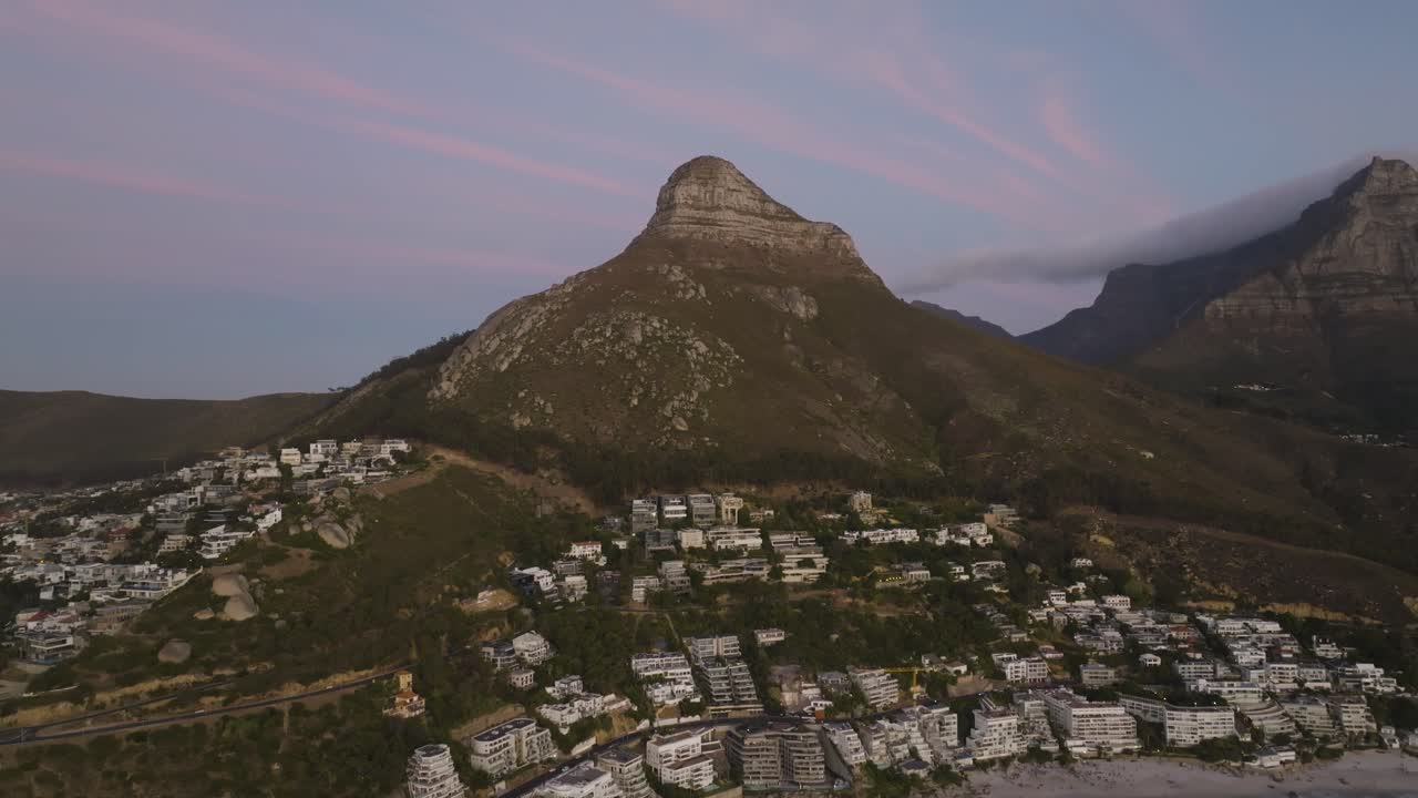 Sunset drone shot of Clifton and Lions Head in Cape Town.