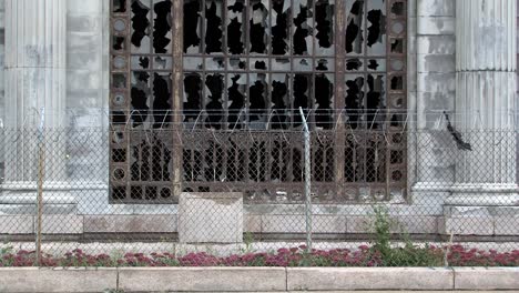 smashed windows with barb wire of michigan station in detroit