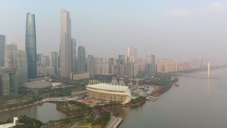 sunny evening guangzhou city downtown famous island stadium riverside aerial panorama 4k china