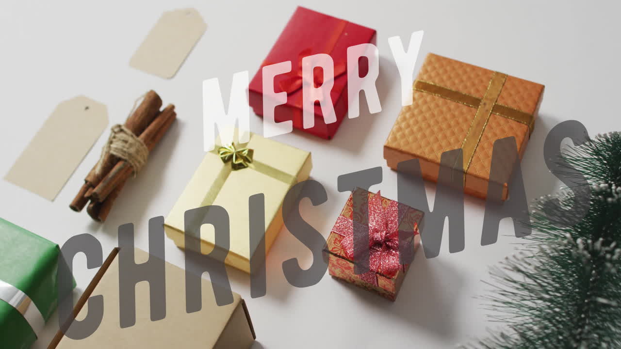 Merry Christmas text animation over various wrapped gifts and holiday decorations