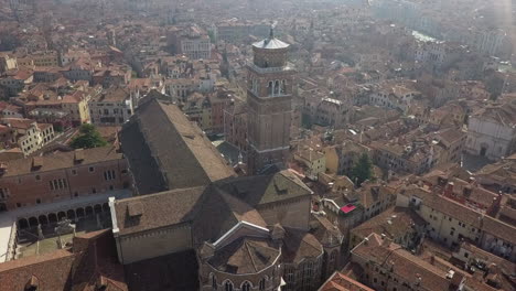 Christian-basilica-tower-Aerial-ascends-above-city-of