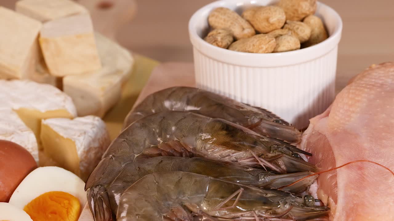 Various protein-rich foods displayed on wooden surface