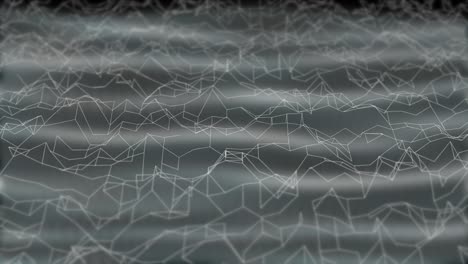 white abstract polygonal waves moving dynamically on black background behind transparent web curtain.