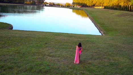 girl dressed in hindu traditional wedding clothes walking