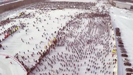 large crowd participating in a winter ski race