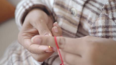 close-up of someone knitting/crochet