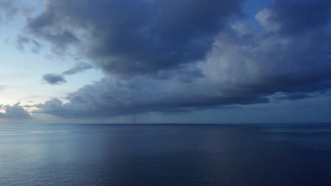 The-Heavy-Blue-Clouds-And-The-Peaceful-And-Relaxing-Island-Beach-In-Fiji-At-Sunset---Aerial-Drone-Shot